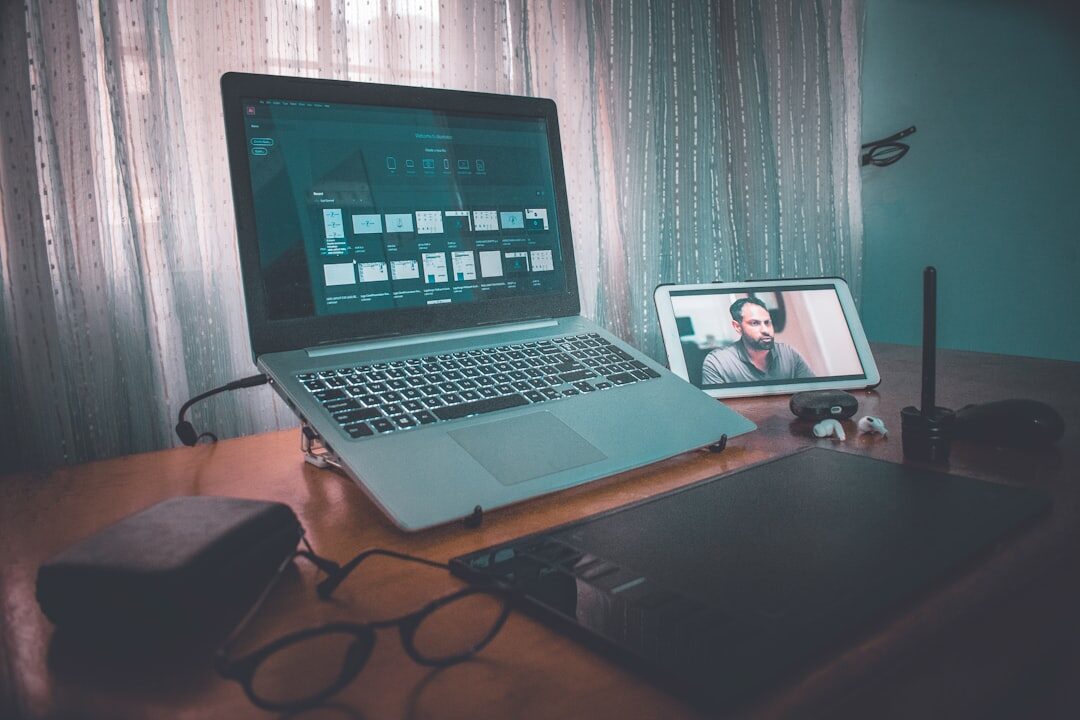 Online video conference on laptop screen with multiple participants
