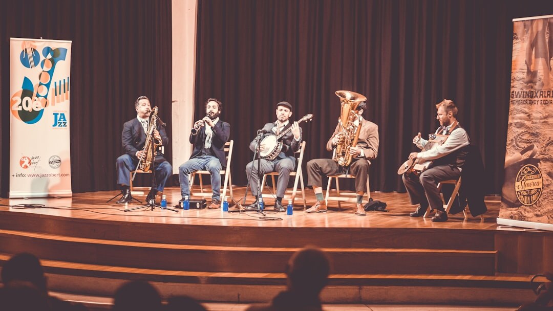 Panel discussion with multiple speakers at a table on stage